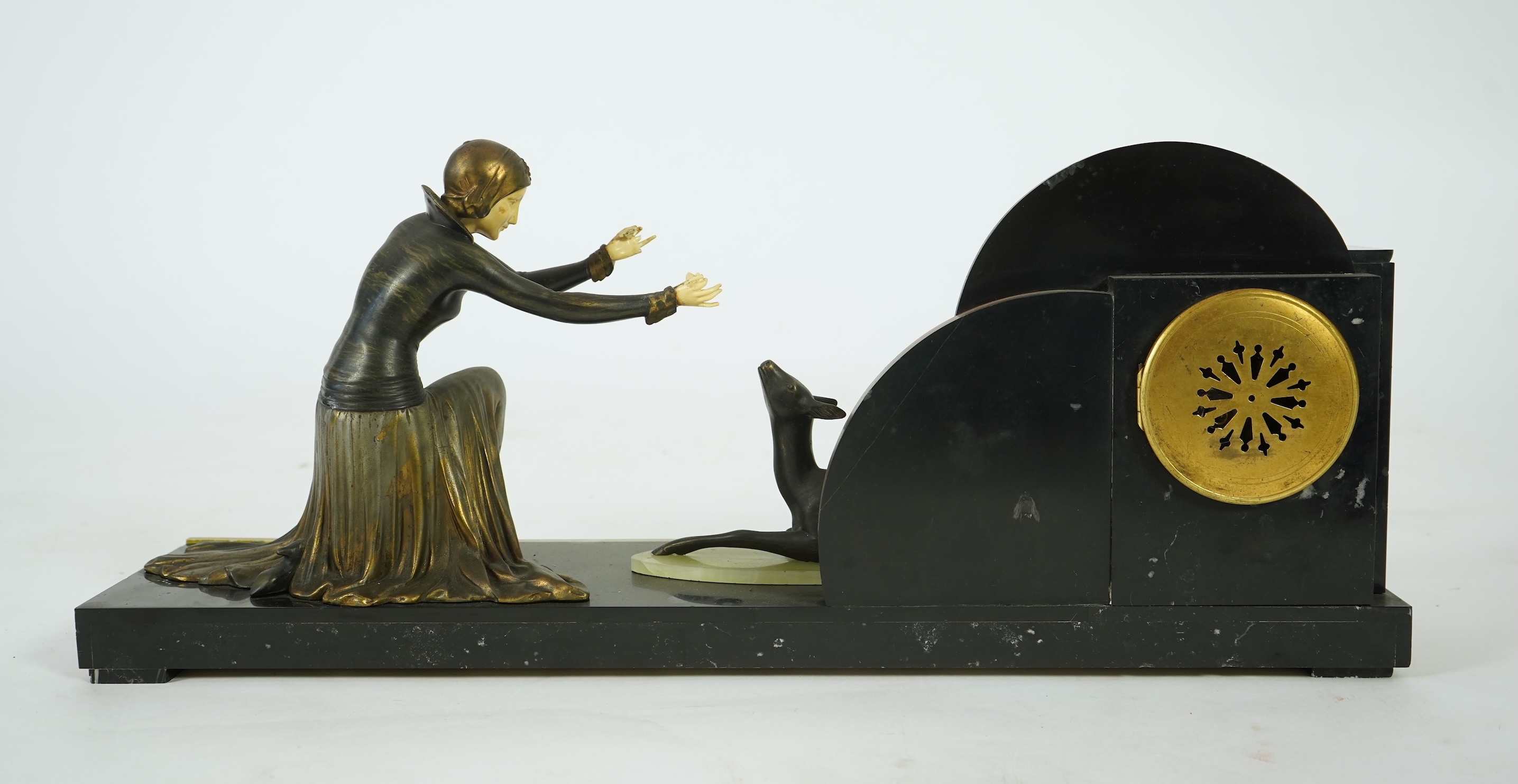 Attributed to Uriano (Ugo Cipriani, Italian, 1897-1960), a Belgian black marble, Rosso red marble and green onyx clock garniture